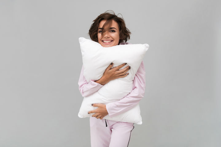 girl holding a pillow